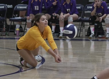 Leah Rodriguez scrambles in Thursday match against Redwood High School.